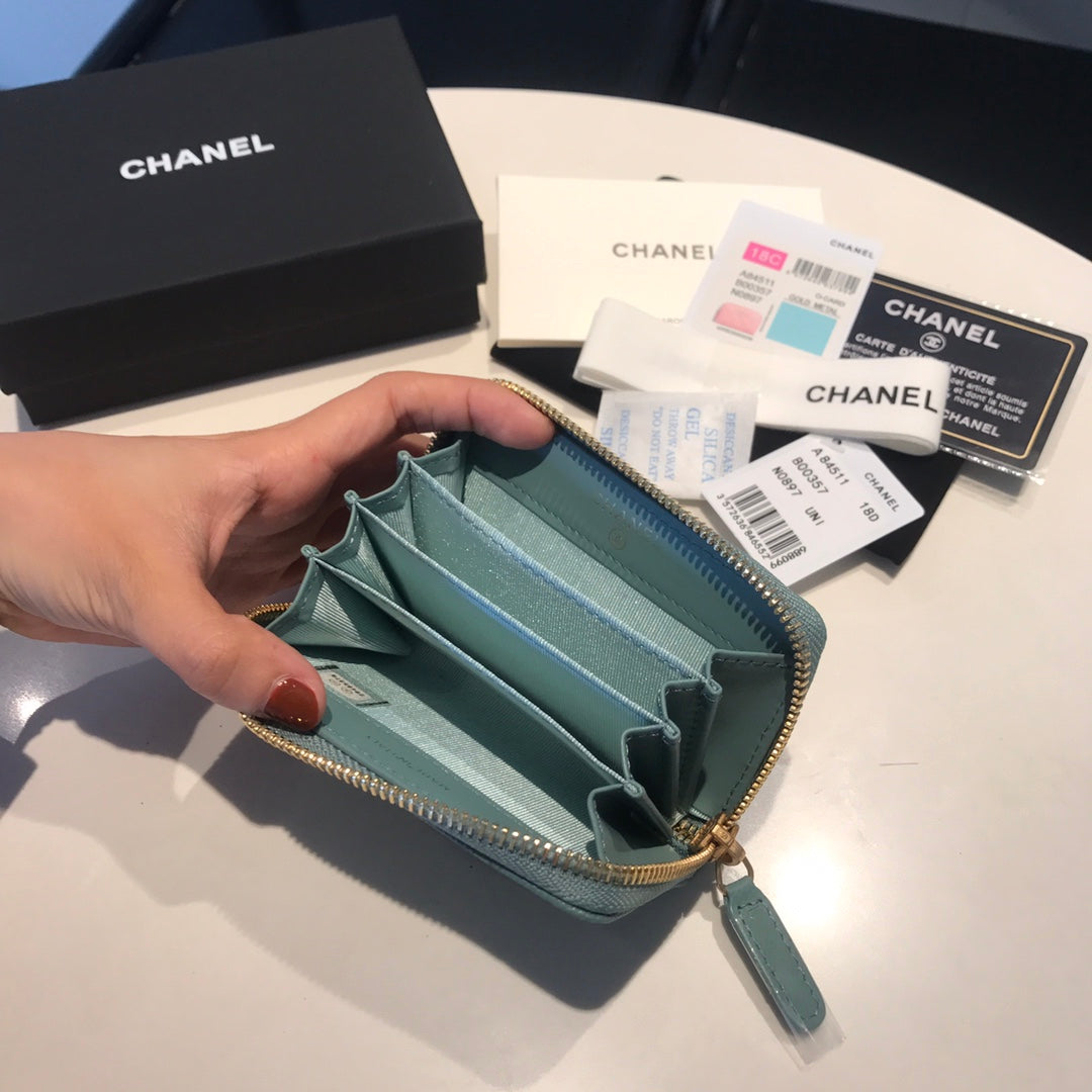 Sac à main zippé CC en cuir caviar 11 bleu sarcelle, icône dorée