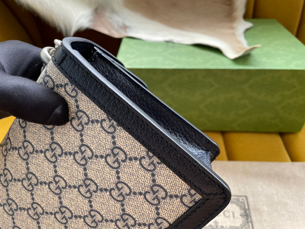 SAC À BANDOULIÈRE DYONYSUS 25 EN TISSU JACQUARD BEIGE AVEC GARNITURE EN CUIR DE VEAU NOIR ET FERMOIR ARGENTÉ