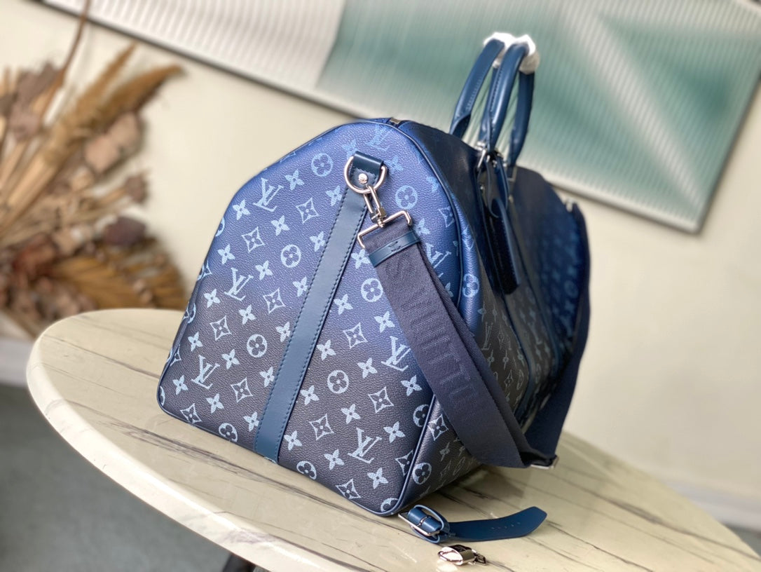 Sac à bandoulière KEEPALL 55 en toile monogrammée vert marine à dégradé
